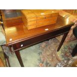George III mahogany rectangular fold-over tea table on square cut chamfered supports with carved