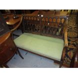 George III beechwood two seat drawing room sofa with a pierced lattice work back and shaped arms