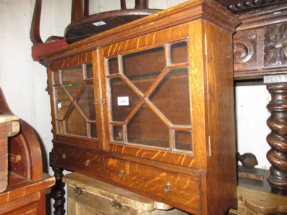 Early 20th Century oak medicine cabinet with two bar glazed doors above two drawers