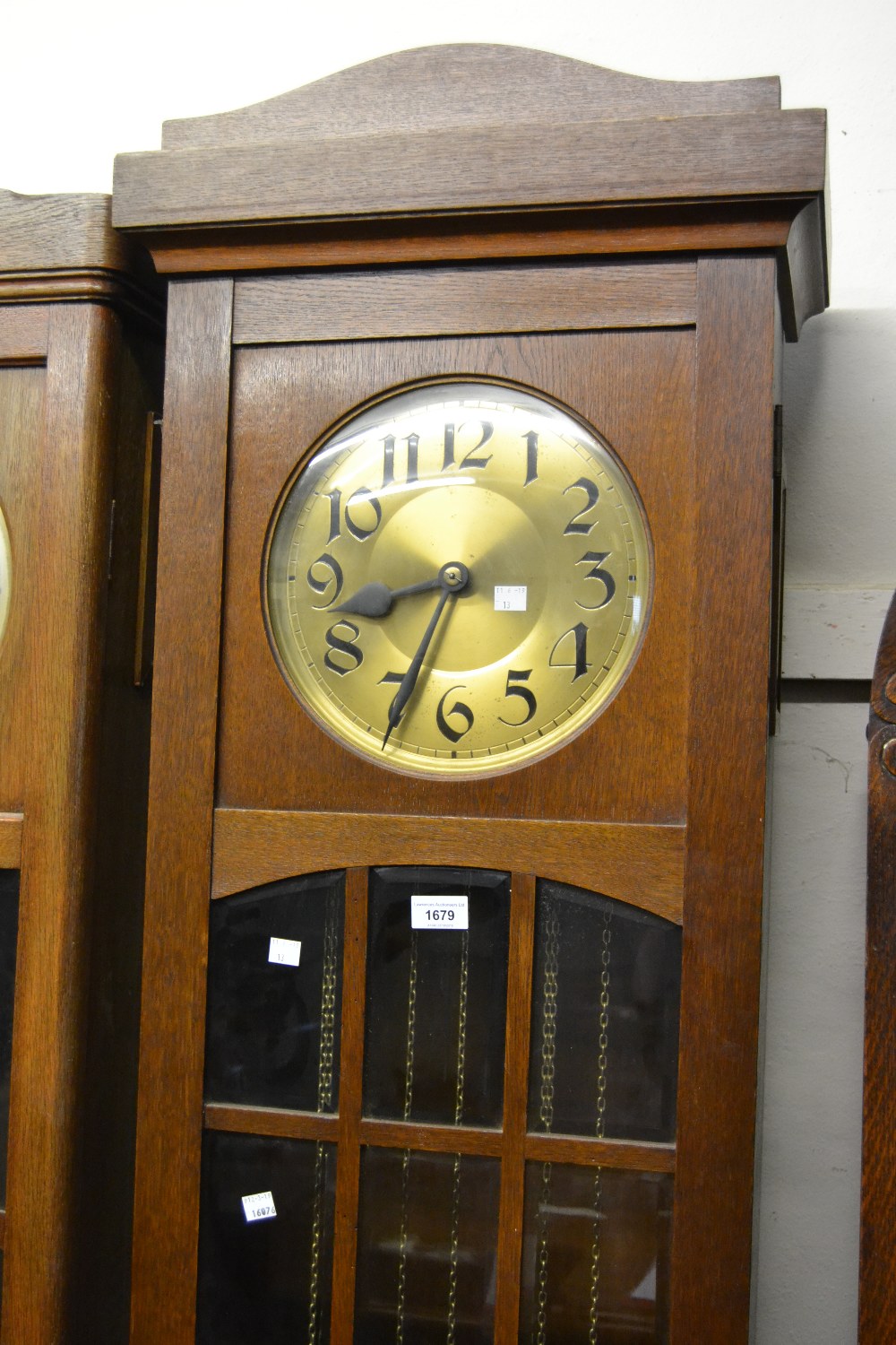 Early to mid 20th Century Continental oak longcase clock, the brass dial with Arabic numerals and