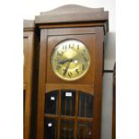 Early to mid 20th Century Continental oak longcase clock, the brass dial with Arabic numerals and