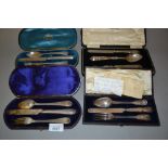 Four various cased Victorian silver three piece Christening sets