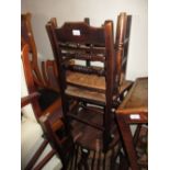 Pair of Regency elm country chairs with rush seats on turned front supports