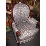 20th Century upholstered armchair with loose cushion on turned tapering reeded front supports