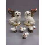 Pair of 19th Century Staffordshire spill vases in the form of seated spaniels, three porcelain