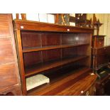 Late 19th or early 20th Century mahogany open bookcase, the moulded top above two adjustable shelves