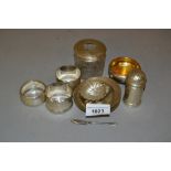 Three various silver napkin rings, pair of silver miniature Armada dishes, a shell form salt with