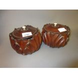 Pair of carved mahogany acanthus form tobacco jars with covers, together with a similar fruit bowl