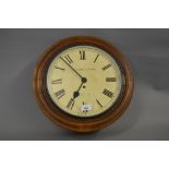 19th Century circular mahogany wall clock, the painted and enamel dial with Roman numerals,