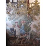 Brass framed floor standing machine woven tapestry of figures on horseback mounted with gilt metal