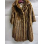 Ladies three quarter length medium brown fur coat, labelled Herbert Duncan, London