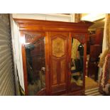 Late 19th / early 20th Century walnut two door wardrobe, having moulded cornice above two carved