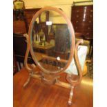 Edwardian mahogany and chequer line inlaid oval swing frame toilet mirror on scroll supports