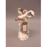 19th Century continental porcelain figure of a girl with tambourine, 8.5ins high Hands and