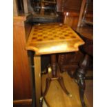 Reproduction mahogany and line inlaid pedestal games table together with a reproduction yew wood