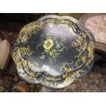 19th Century circular black papier mache tray by Jennens and Bettridge with floral painted and