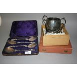 Cased set of four silver plated Apostle handled serving spoons, two handled plated sugar bowl,