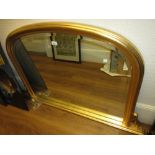 Reproduction gilt over mantel mirror with bevelled plate