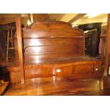 Small Victorian mahogany serpentine fronted chiffonier with a shelf back and two panelled doors,