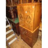Art Deco burr walnut drinks cabinet having two flush panelled doors enclosing a mirrored fitted