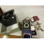 Argus twin lens camera, pair of 10 x 50 binoculars, two cigarette lighters, an Academy of Music
