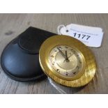 Jaeger le Coultre, mid 20th Century travel watch, the engine turned gilt brass case enclosing a