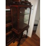 Mahogany display cabinet in 17th / 18th Century style, the moulded top above a glazed door enclosing