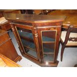 Small rosewood and parcel gilt side cabinet of shallow proportions with a central glazed door