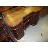19th Century mahogany inverted bow fronted dressing table having moulded top above three drawers