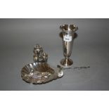 Birmingham silver spill vase, a small Finnish silver ladle, a plated shell form butter dish, two