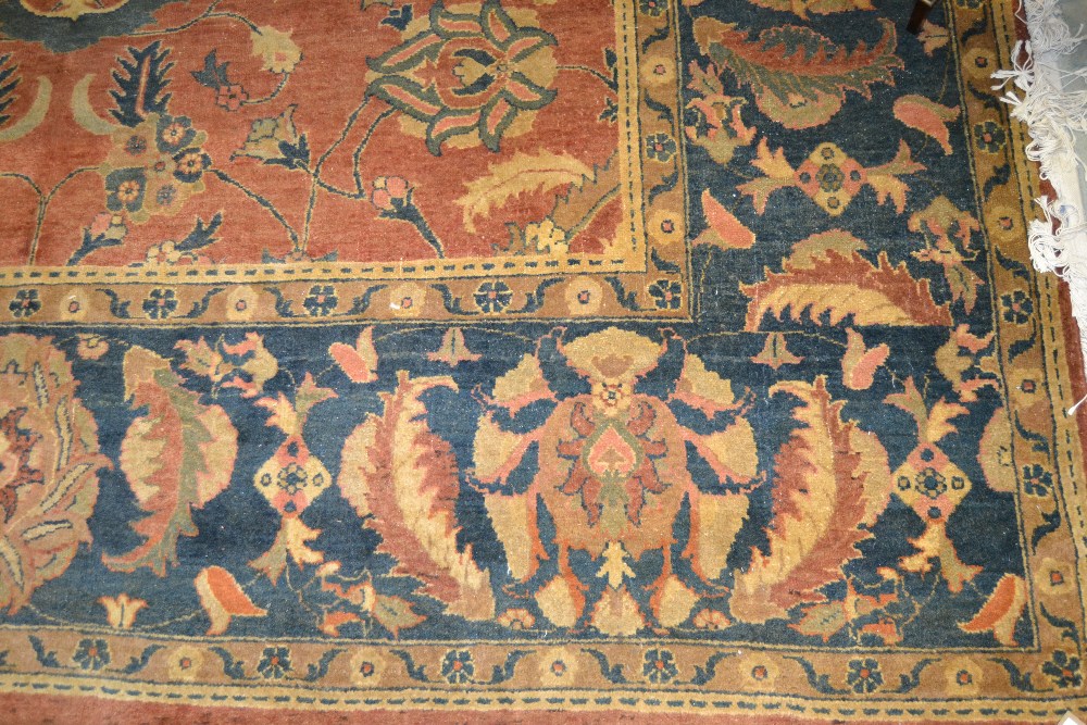 Agra carpet of all-over floral design on a burgundy ground with multiple borders, 116ins x 160ins ( - Image 2 of 4