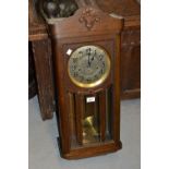 Early 20th Century oak cased wall clock with a silvered dial, Arabic numerals and three train