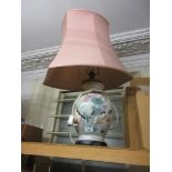 Modern Chinese style baluster form table lamp base on ebonised plinth with pink shade