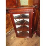 George III mahogany and inlaid hanging corner cabinet, the moulded dentil cornice above bar glazed