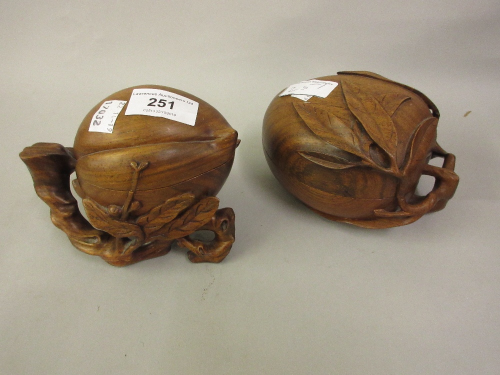 Two native carved hardwood boxes with covers