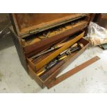 Wooden carpenter's cabinet containing various chisels etc