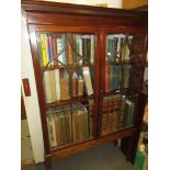 Late Georgian mahogany bookcase top on a later stand, with a moulded dentil cornice above two