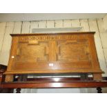 Early 20th Century oak coffer with hinged lid above a moulded panel front