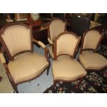 Pair of late 19th Century French carved walnut and upholstered drawing room armchairs raised on