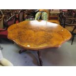 Victorian figured walnut oval shaped edge tilt-top centre table on turned column and quadruped splay