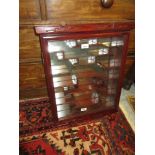 Small Chinese hardwood wall cabinet, with a single glazed panelled door enclosing shaped shelves