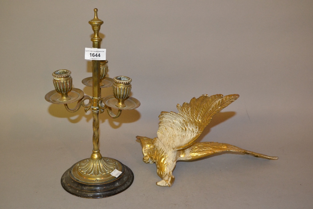 19th Century brass three light candelabra with a circular ebonised base, together with a brass