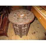 Middle Eastern octagonal carved hardwood table with mother of pearl inlay and mashrabiya panels