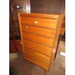 Mid 20th Century teak six drawer narrow chest with integral handles on low turned tapering supports