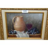 Modern oil on board, still life, grapes, wine and a jug on a marble ledge, gilt framed, 8ins x