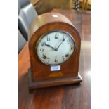 Edwardian mahogany line inlaid mantel clock having circular dial with arabic numerals and two