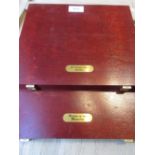 Two cases containing a collection of twenty one miniature 14ct gold coins