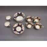 Three 19th Century English tea cups with saucers decorated with panels of flowers on cobalt blue and
