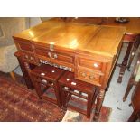 Late 19th / early 20th Century Chinese export padouk wood dressing table, the hinged lid enclosing a