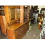Early 20th Century oak side cabinet / dresser, the shaped top above four glazed doors, the base with
